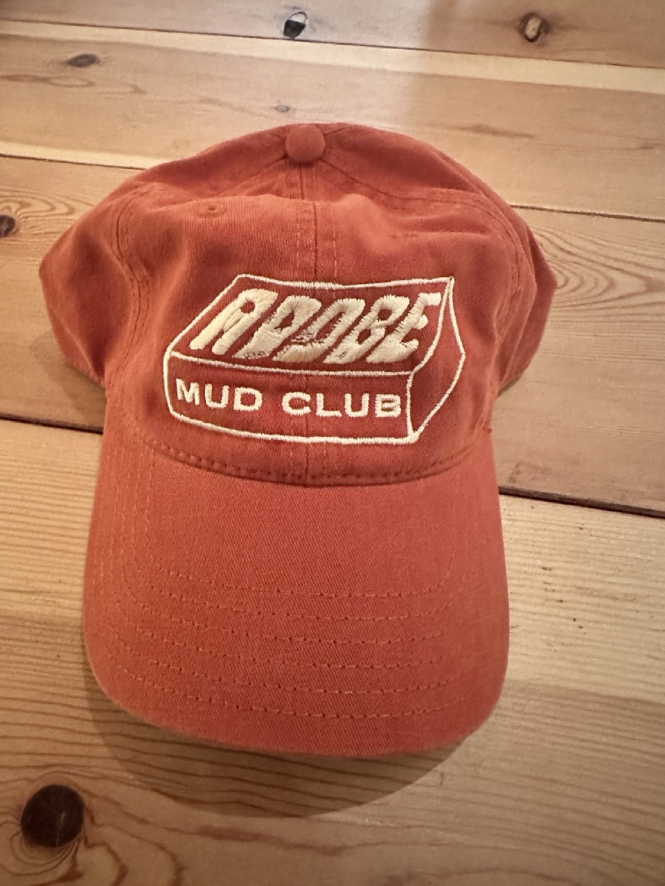 Terracotta Adobe Mud Club dad hat with embroidered logo